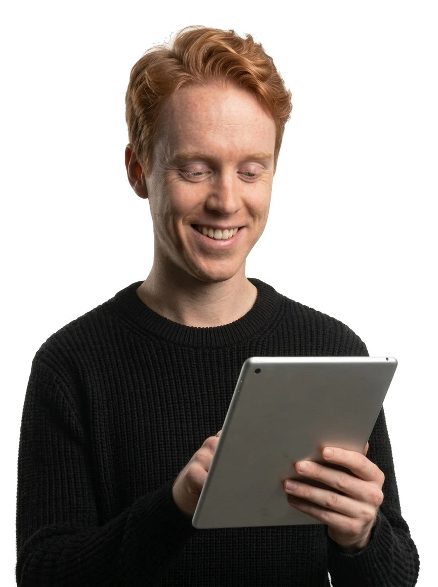 A smiling young business owner checking a tablet